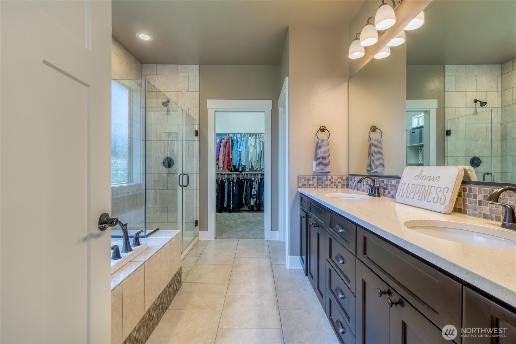341 Reserve Way Walla Walla, WA 99362 - Photo 15 of 40 a spacious bathroom with a double vanity sink a large mirror and shower