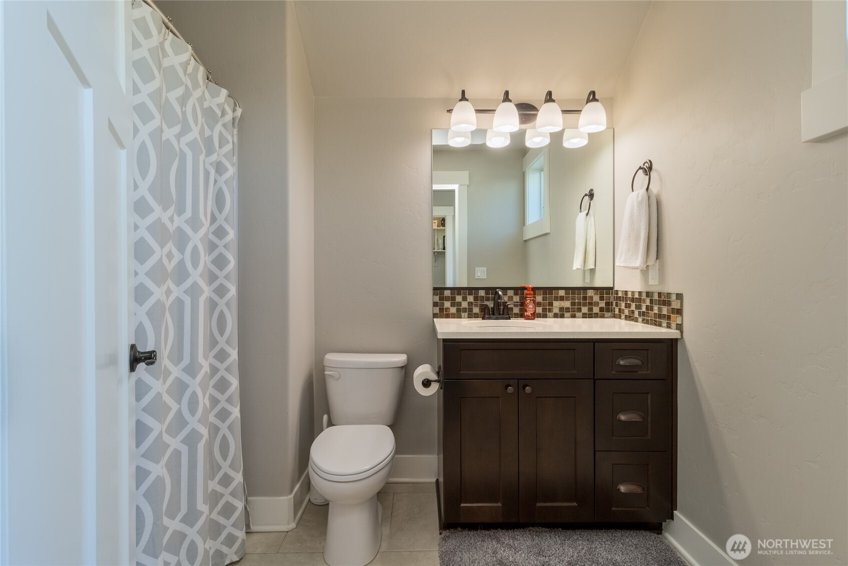 341 Reserve Way Walla Walla, WA 99362 - Photo 27 of 40 a bathroom with a toilet a sink and mirror