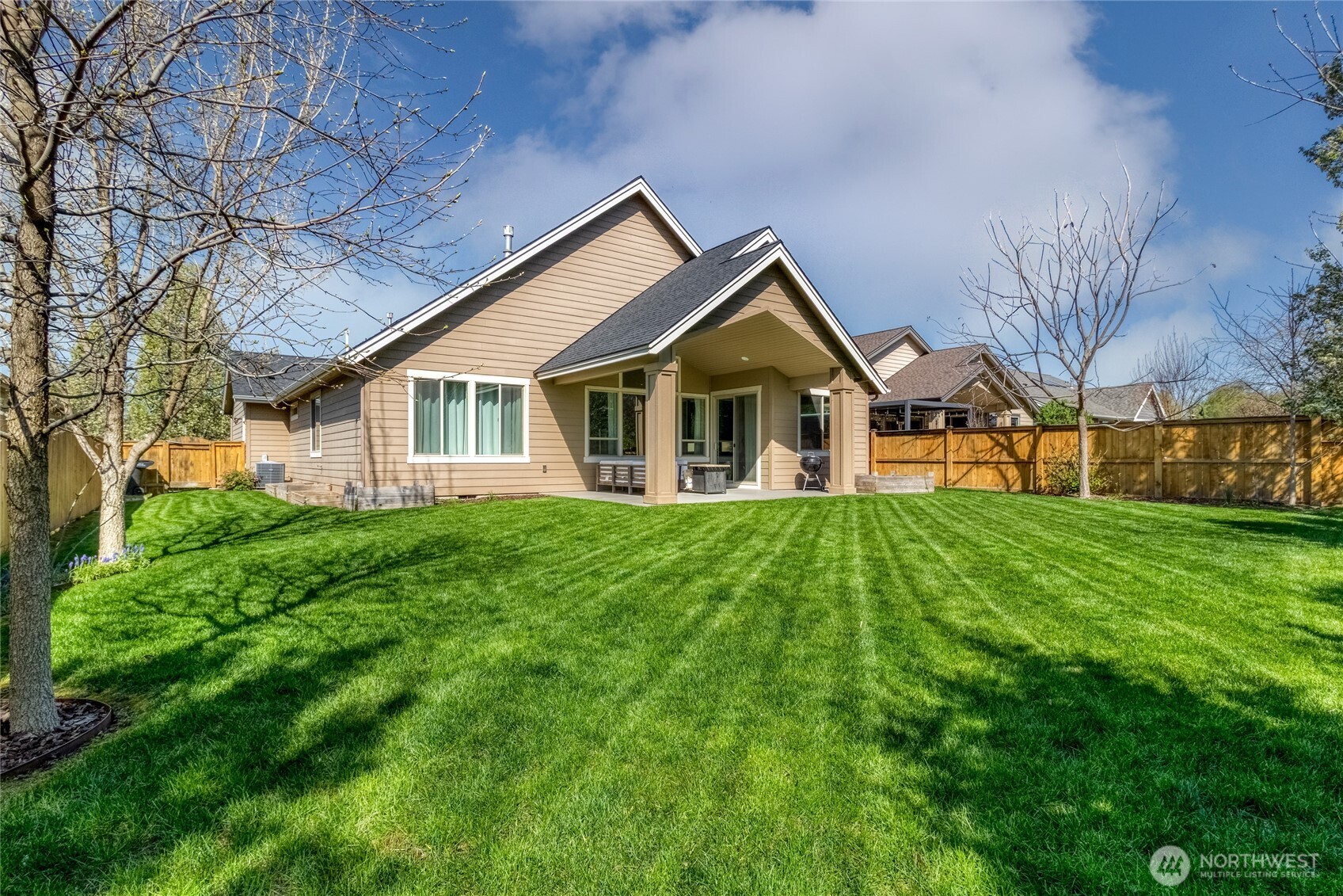 341 Reserve Way Walla Walla, WA 99362 - Photo 33 of 40 a view of a house with a big yard potted plants and large tree