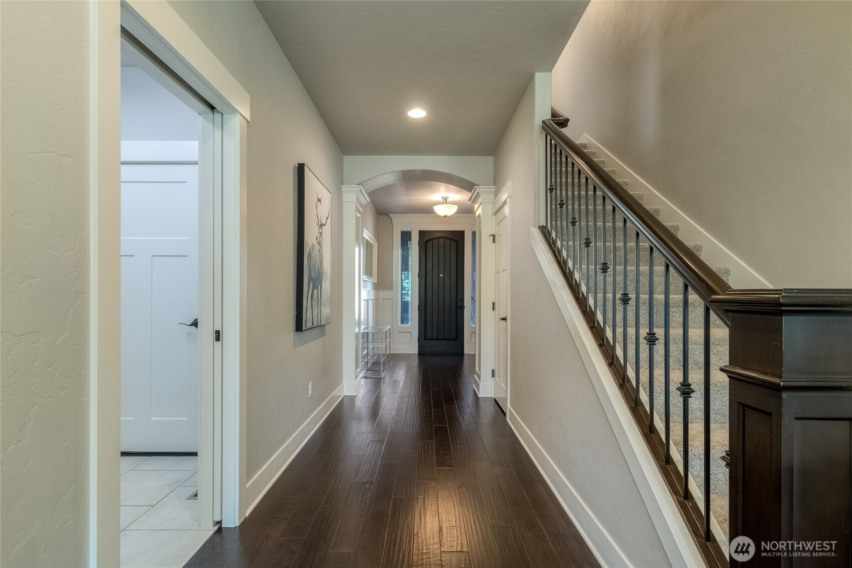 341 Reserve Way Walla Walla, WA 99362 - Photo 5 of 40 a view of a hallway with wooden floor and stairs