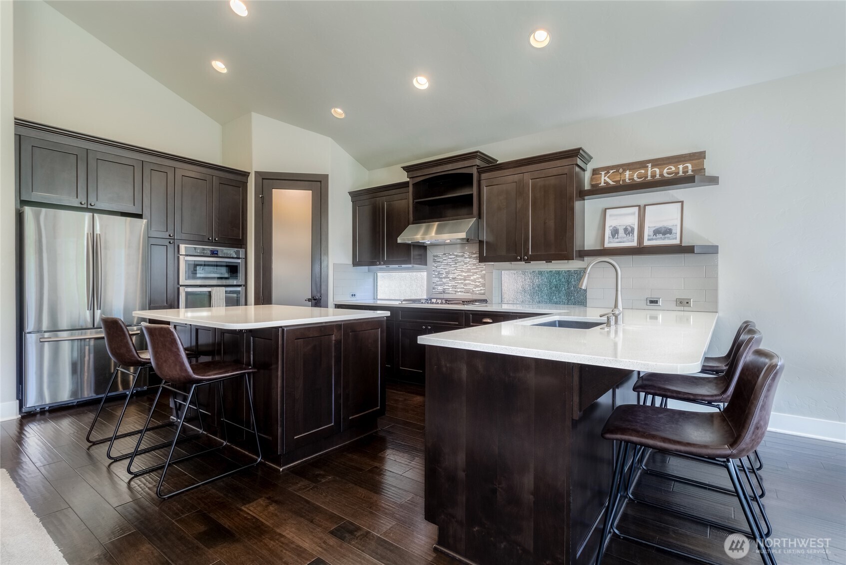 341 Reserve Way Walla Walla, WA 99362 - Photo 10 of 40 a kitchen with a table chairs refrigerator and microwave