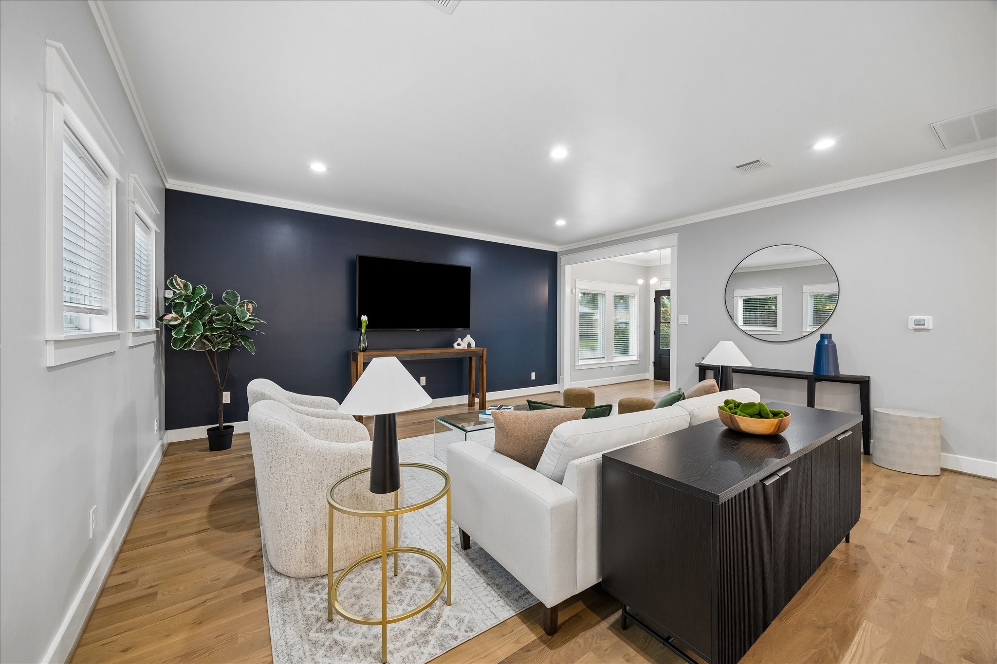 1205 Temple Street Houston, TX 77009 - Photo 11 of 33 Comfort and style meet effortlessly in a living space designed for everyday living, where every sightline connects seamlessly to the kitchen and dining areas.