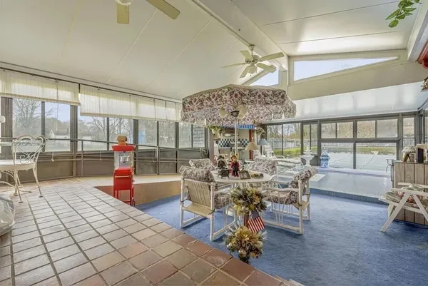 a living room filled with furniture and a table