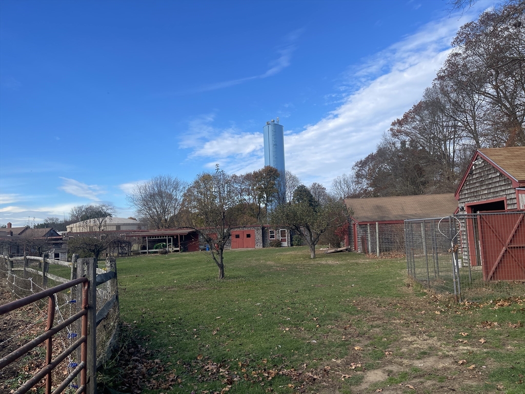 1789 Broadway Raynham, MA 02767 - Photo 5 of 17 a view of a house with a yard
