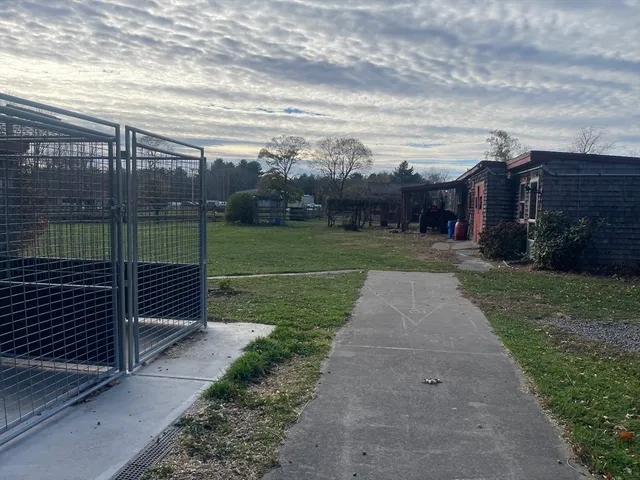 a view of a stadium that has a big yard next to a road