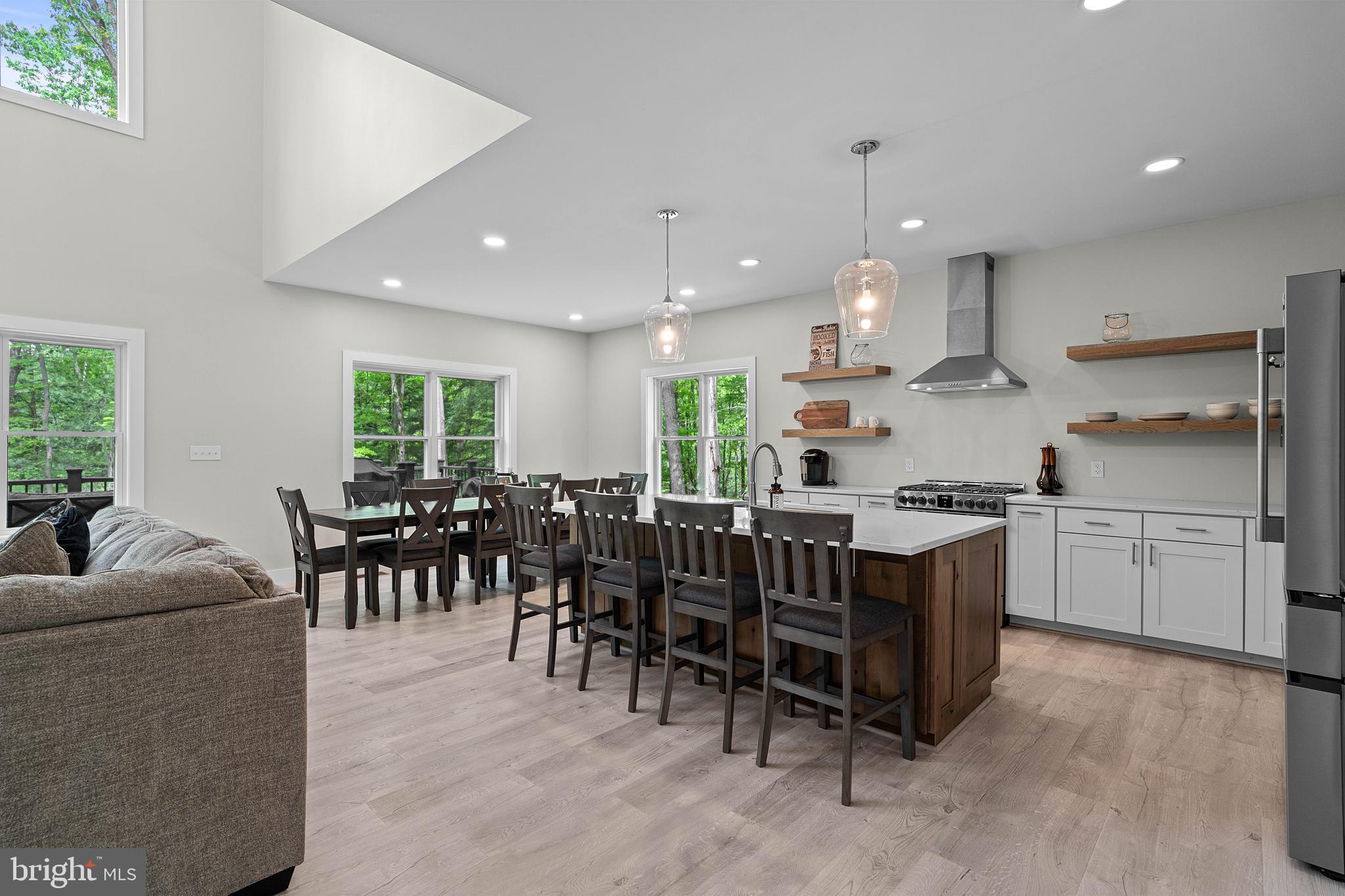 2645 Carribean Road Du Bois, PA 15801 - Photo 18 of 55 a large kitchen with kitchen island a dining table chairs and a refrigerator