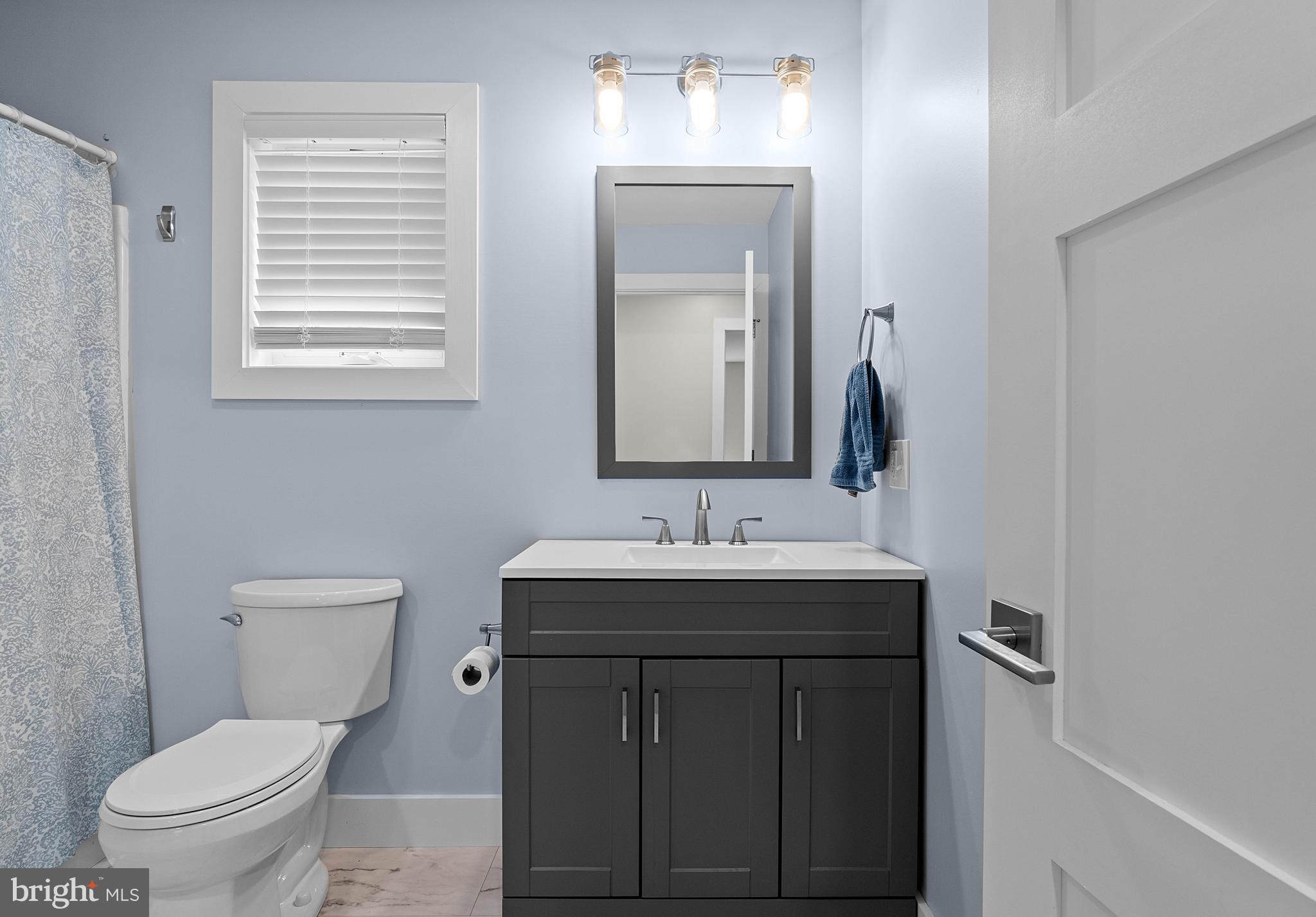 2645 Carribean Road Du Bois, PA 15801 - Photo 30 of 55 a bathroom with a toilet a sink a vanity and mirror