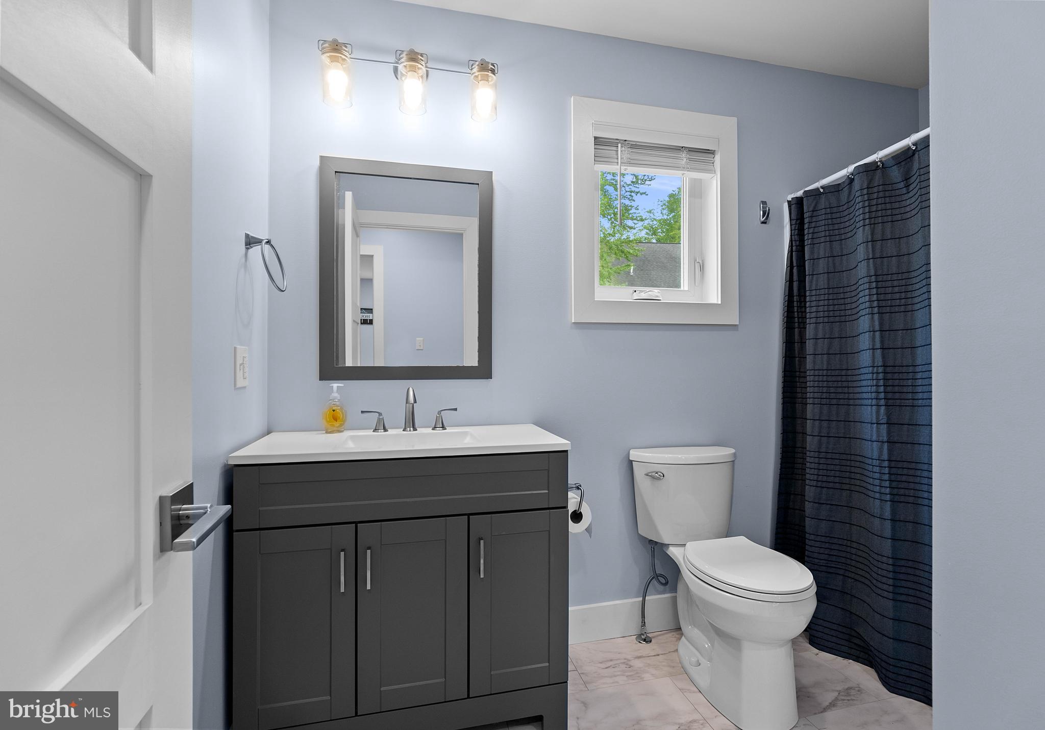2645 Carribean Road Du Bois, PA 15801 - Photo 32 of 55 a bathroom with a toilet a sink a vanity and mirror