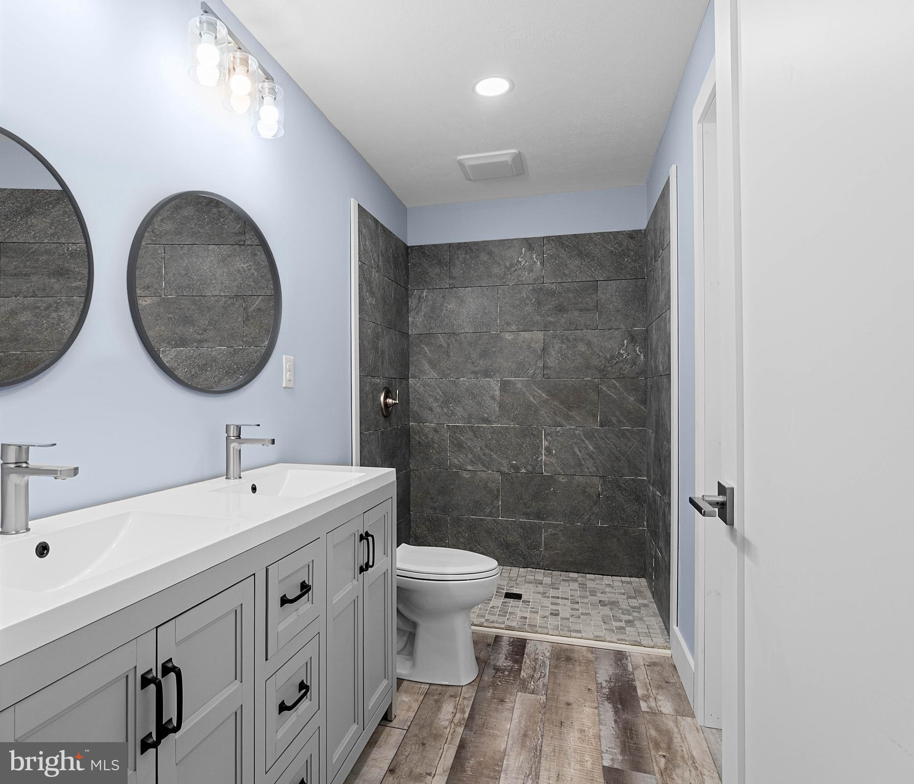 2645 Carribean Road Du Bois, PA 15801 - Photo 37 of 55 a bathroom with a double vanity sink toilet and shower
