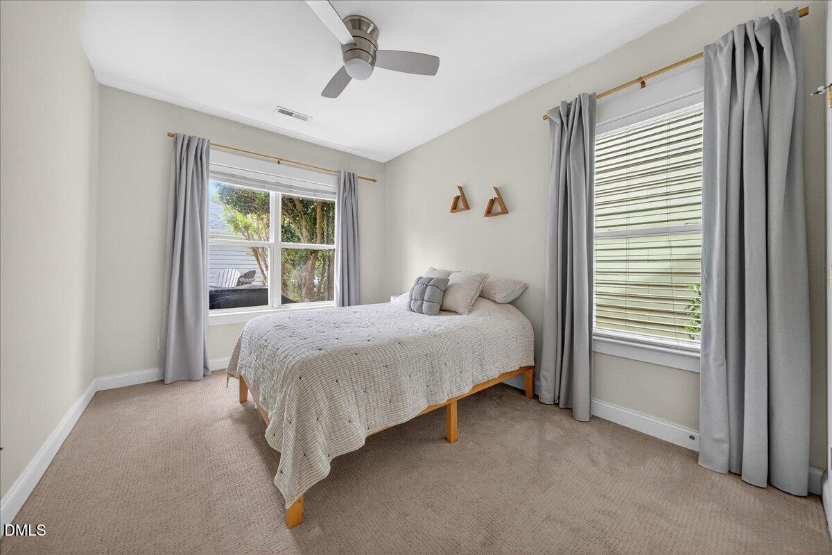 2116 Dunn Road Raleigh, NC 27614 - Photo 15 of 22 a bedroom with a bed and a window