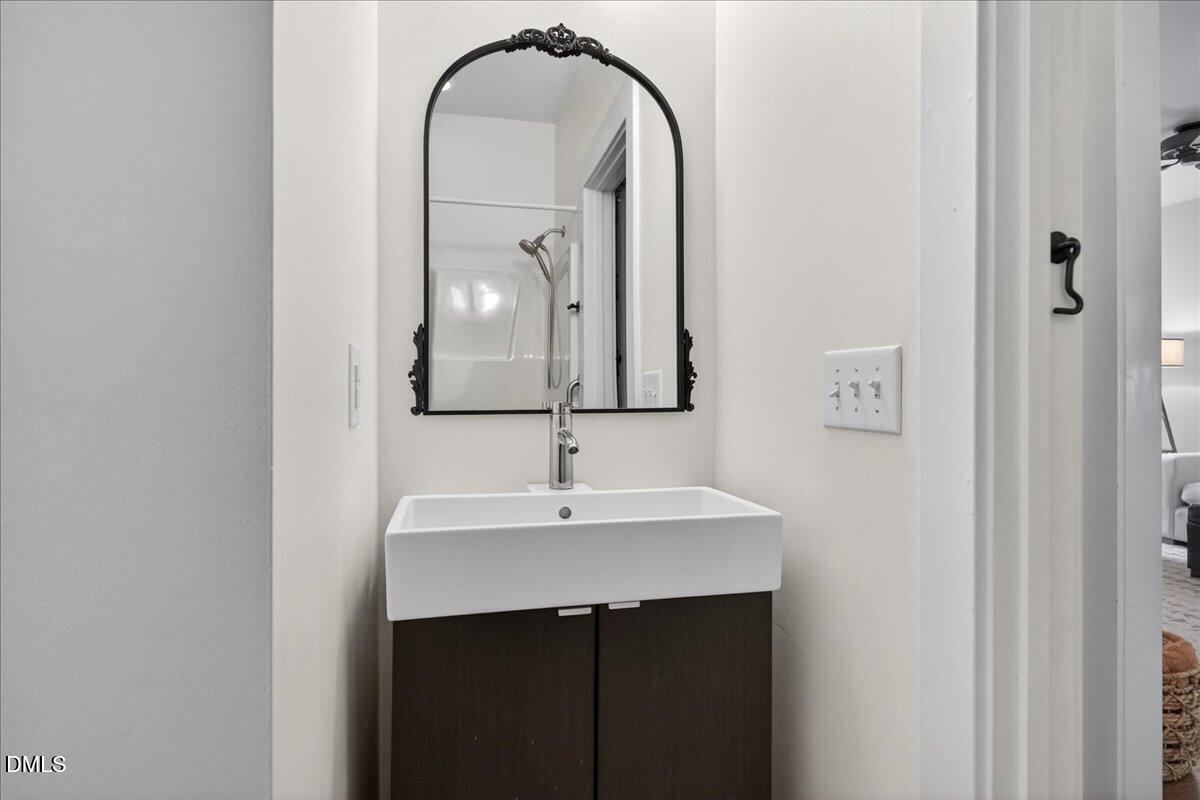 2116 Dunn Road Raleigh, NC 27614 - Photo 17 of 22 a bathroom with a sink and a mirror