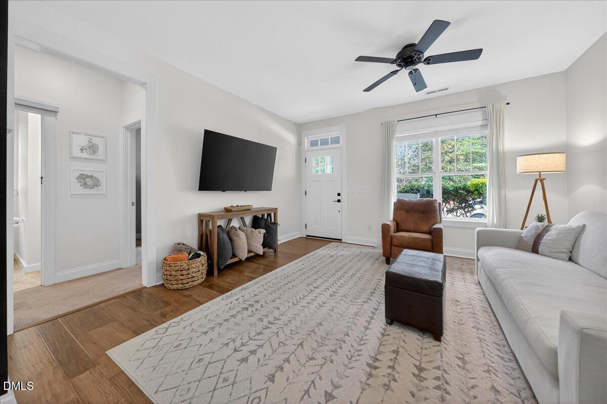 2116 Dunn Road Raleigh, NC 27614 - Photo 5 of 22 a living room with furniture and a flat screen tv
