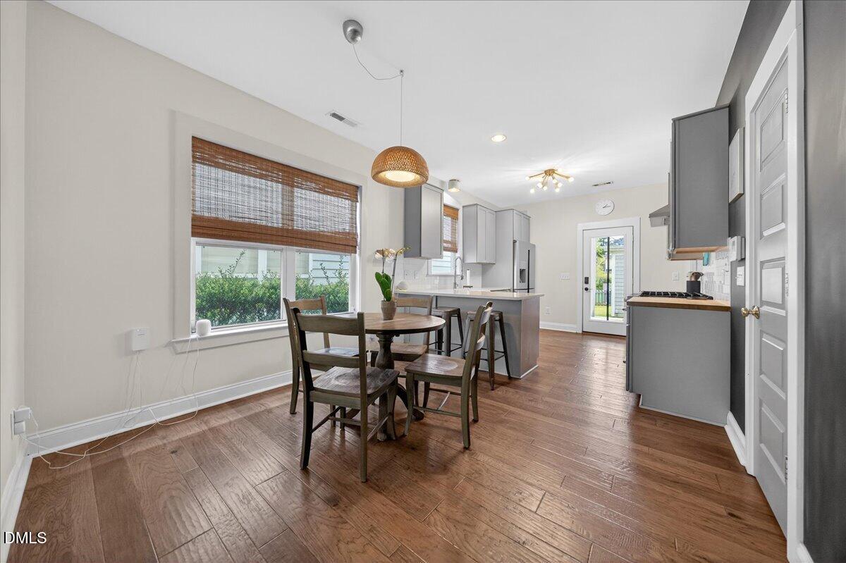 2116 Dunn Road Raleigh, NC 27614 - Photo 6 of 22 a dining room with furniture window wooden floor