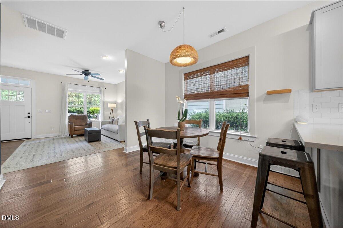 2116 Dunn Road Raleigh, NC 27614 - Photo 7 of 22 a view of a dining room with furniture and wooden floor