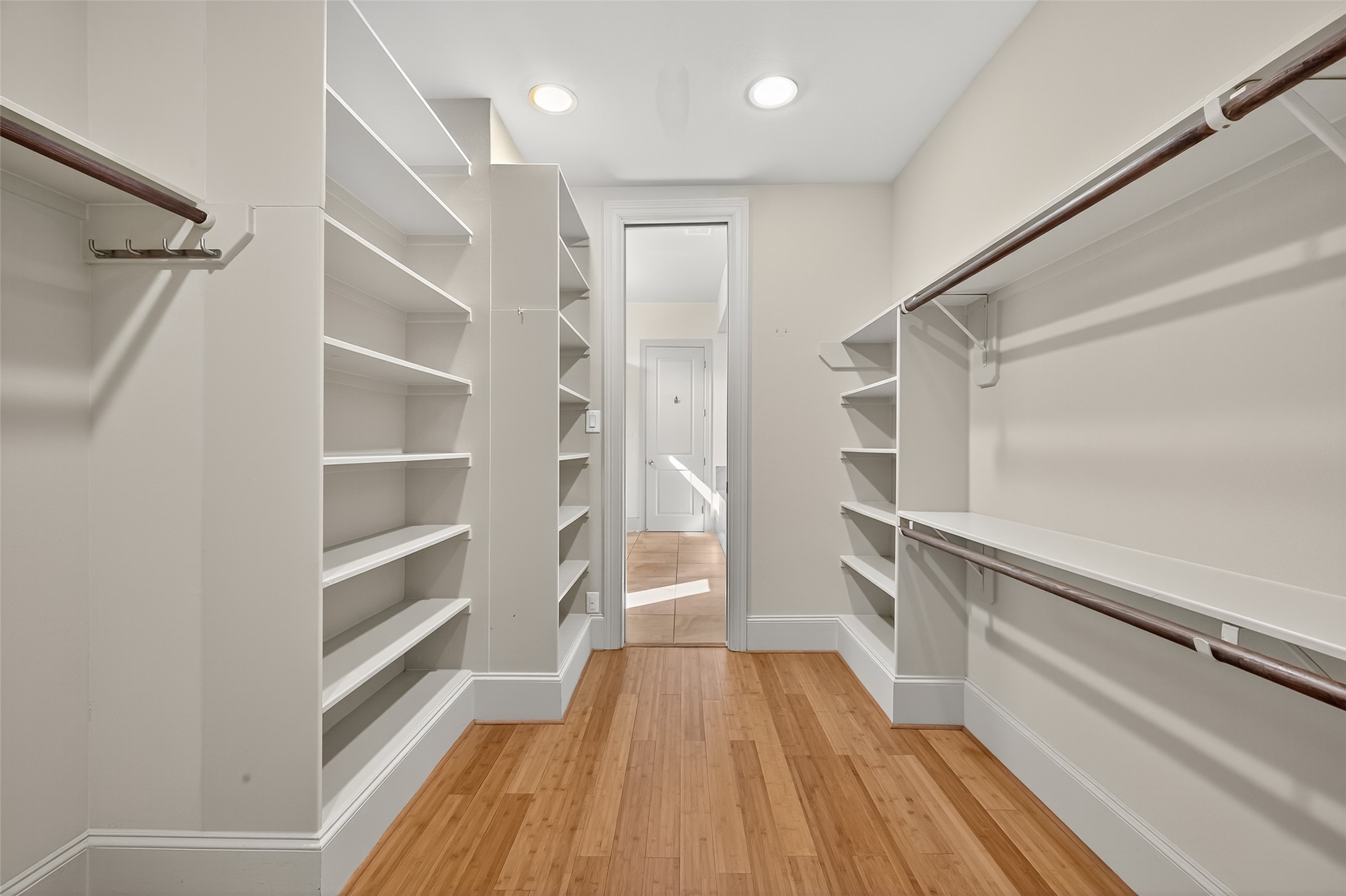 931 West 23rd Street, Unit K Houston, TX 77008 - Photo 21 of 40 Beautifully organized primary closet with custom built-ins—perfect for keeping clothing, shoes, and accessories effortlessly tidy.