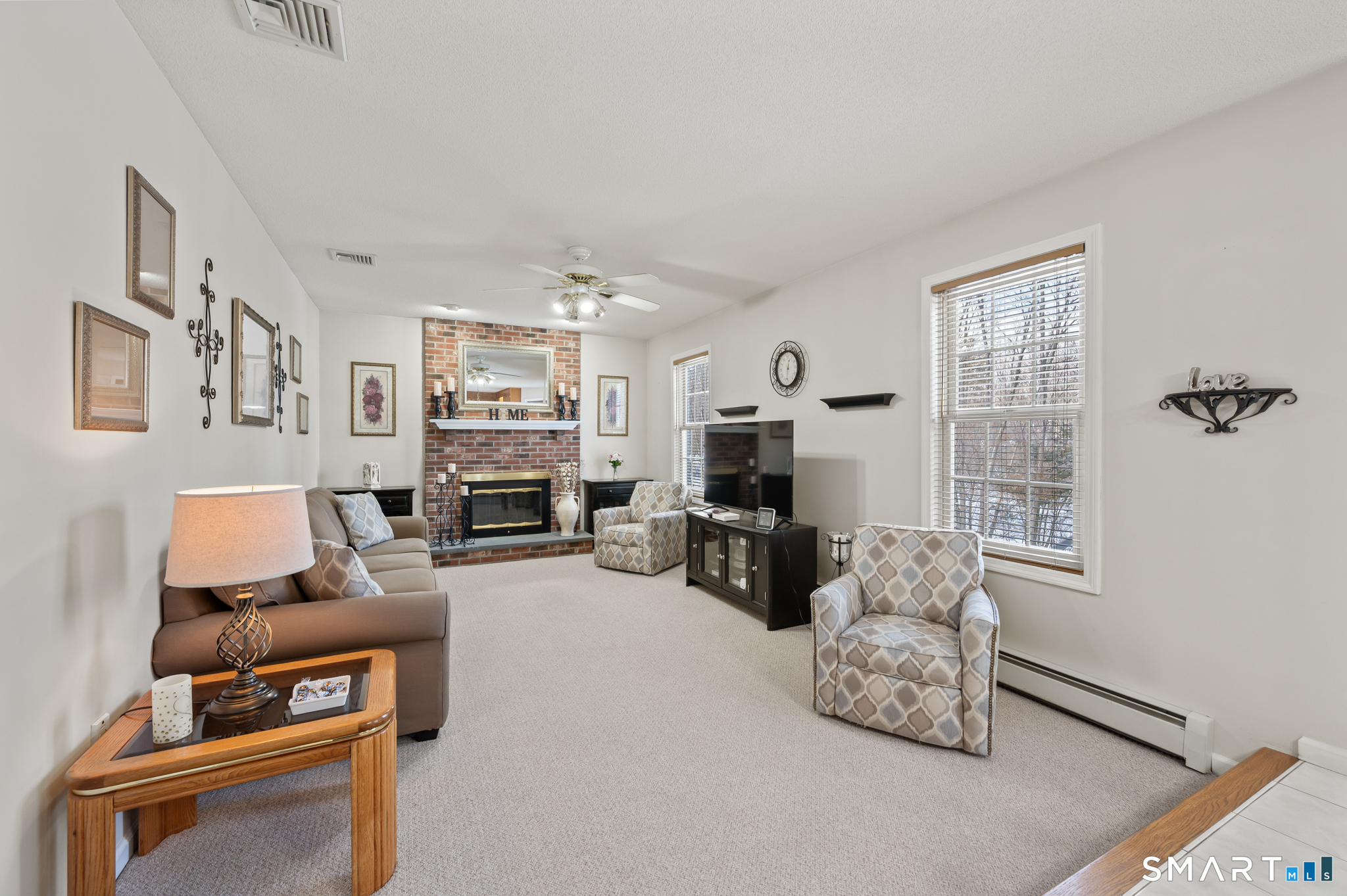 19 Woodside Way Bristol, CT 06010 - Photo 19 of 43 Family room with fireplace is open to the kitchen and breakfast nook to create an open common space
