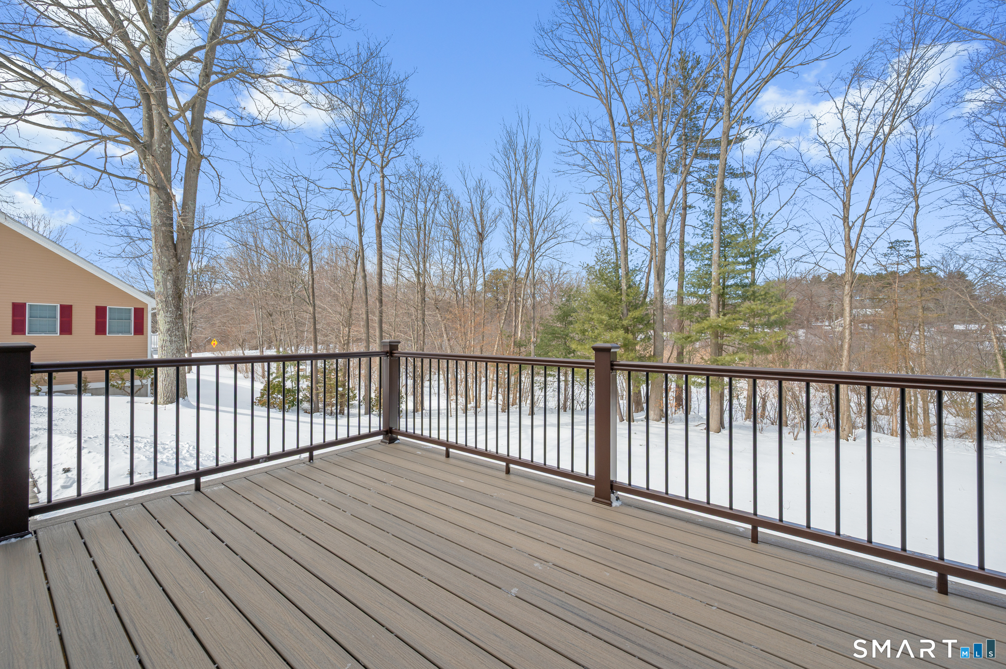 19 Woodside Way Bristol, CT 06010 - Photo 35 of 43 New deck overlooking the gently sloping, cleared yard with inground irrigation