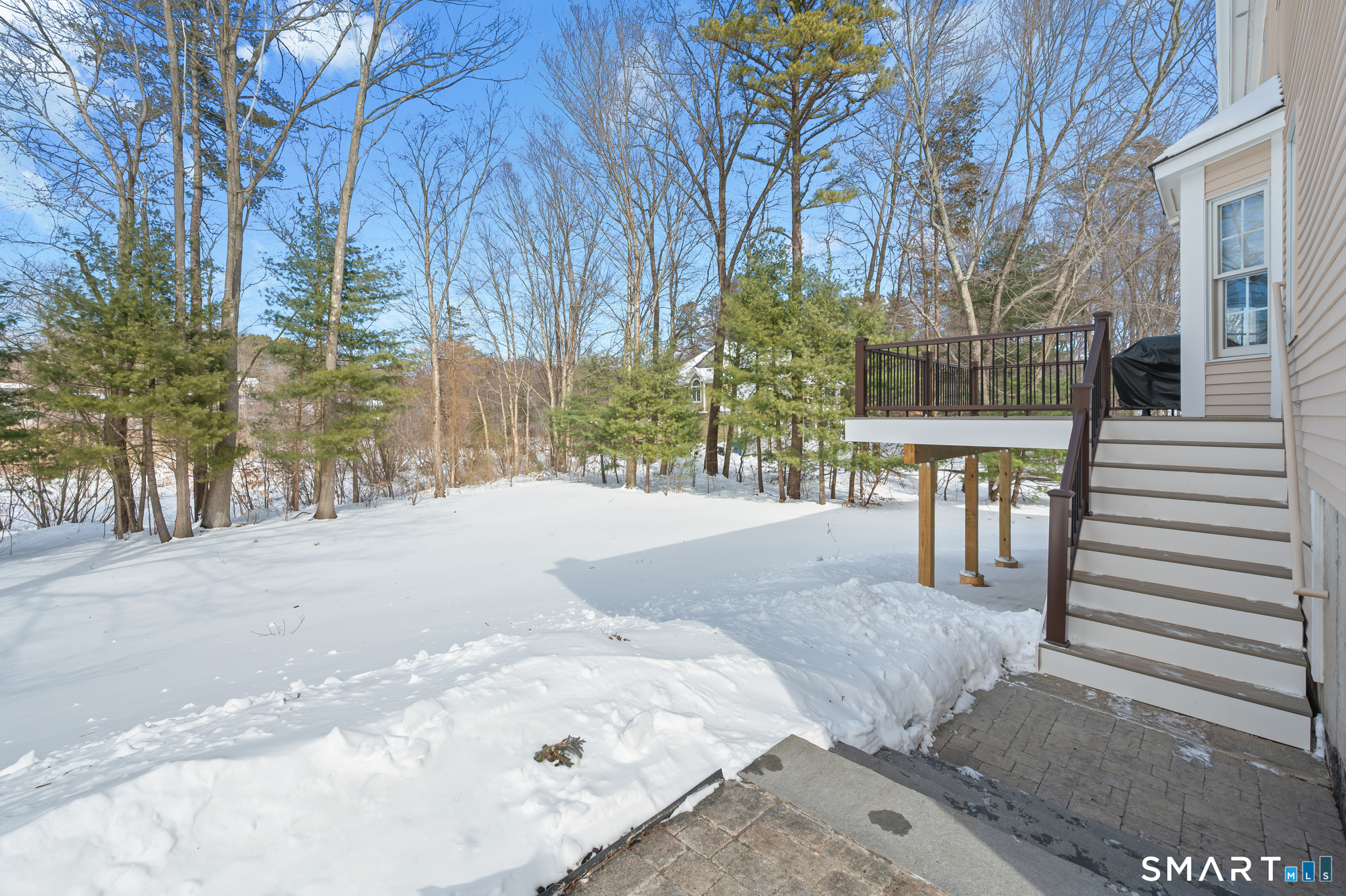 19 Woodside Way Bristol, CT 06010 - Photo 37 of 43 New paver walk way from driveway around to connect the rear landing patio and deck