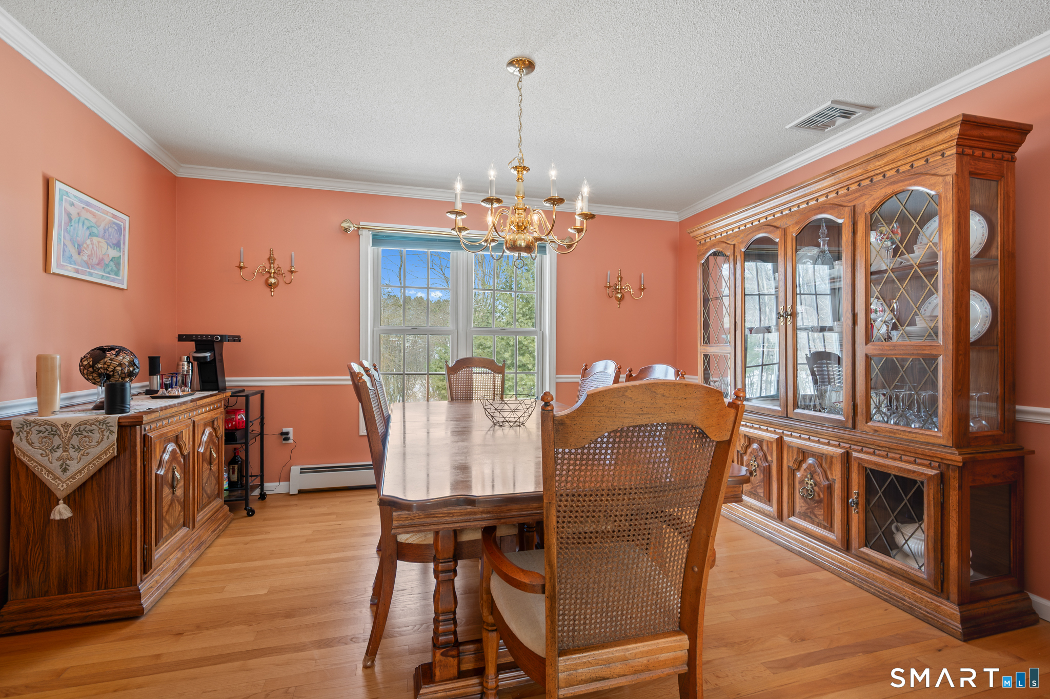 19 Woodside Way Bristol, CT 06010 - Photo 9 of 43 Dining room features wood floors and plenty of space for traditional gatherings