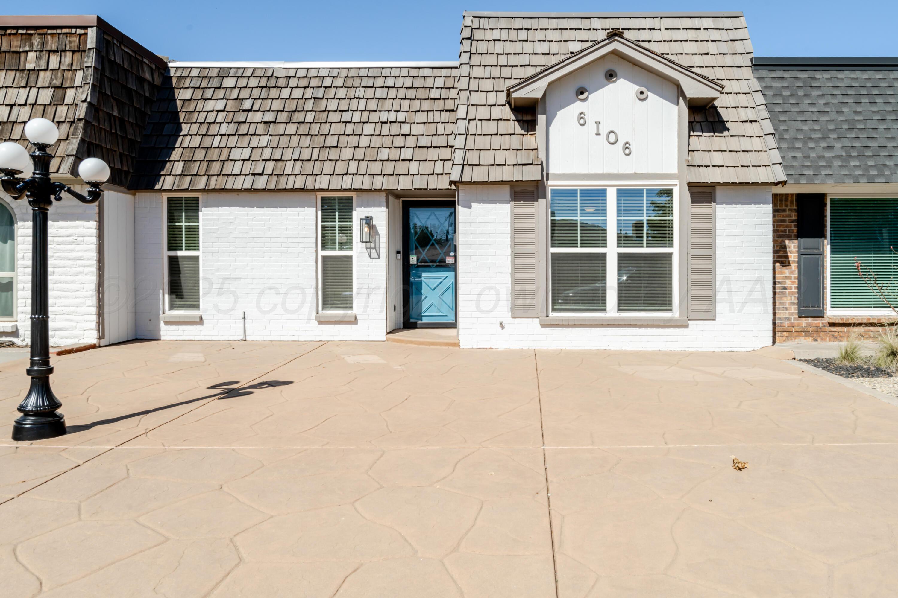 6106 Belpree Road Amarillo, TX 79106 - Photo 2 of 33 a front view of a house with a yard