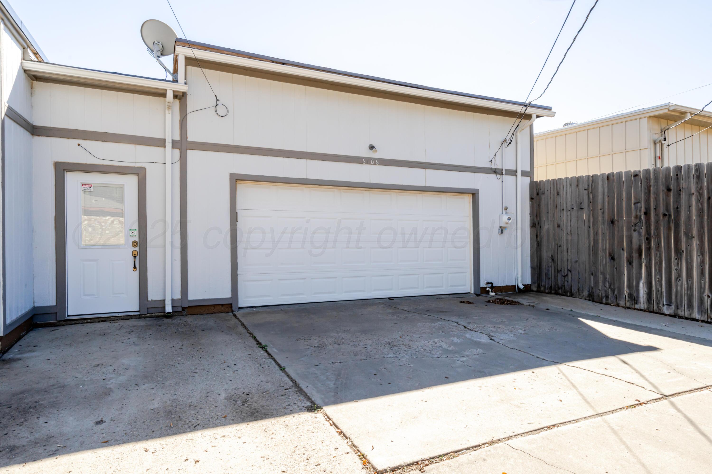 6106 Belpree Road Amarillo, TX 79106 - Photo 31 of 33 a view of backyard with garage