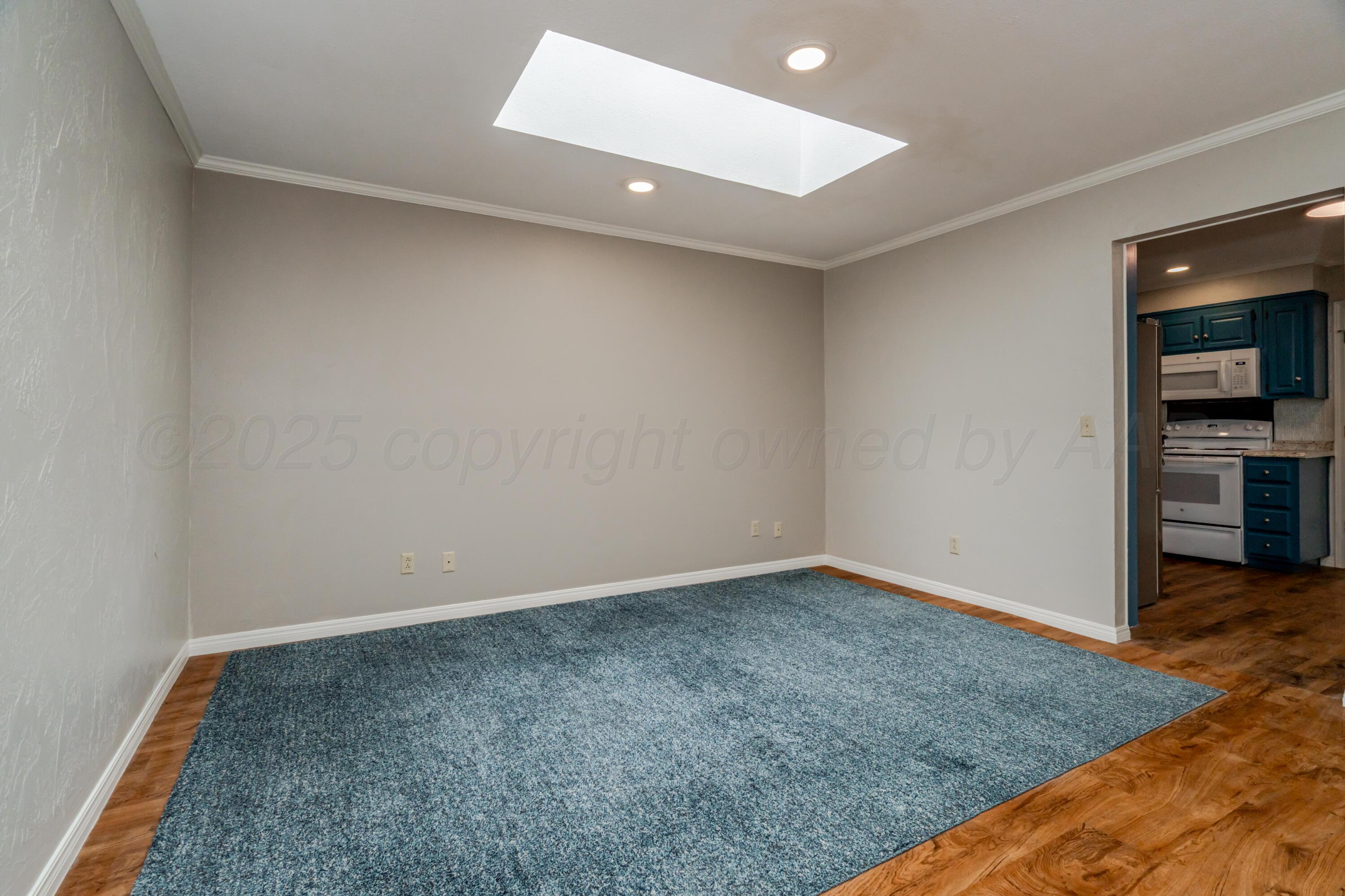 6106 Belpree Road Amarillo, TX 79106 - Photo 10 of 33 an empty room with a bench and cabinet