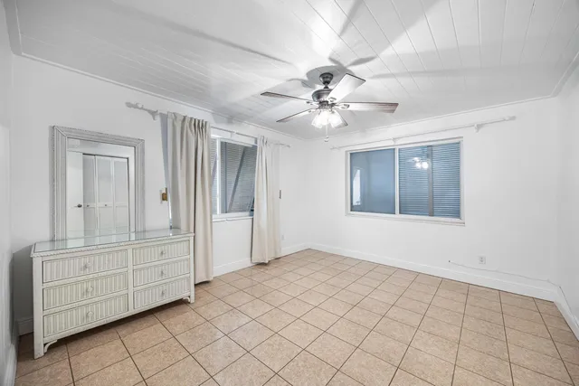 a view of an empty room with cabinet and cabinet