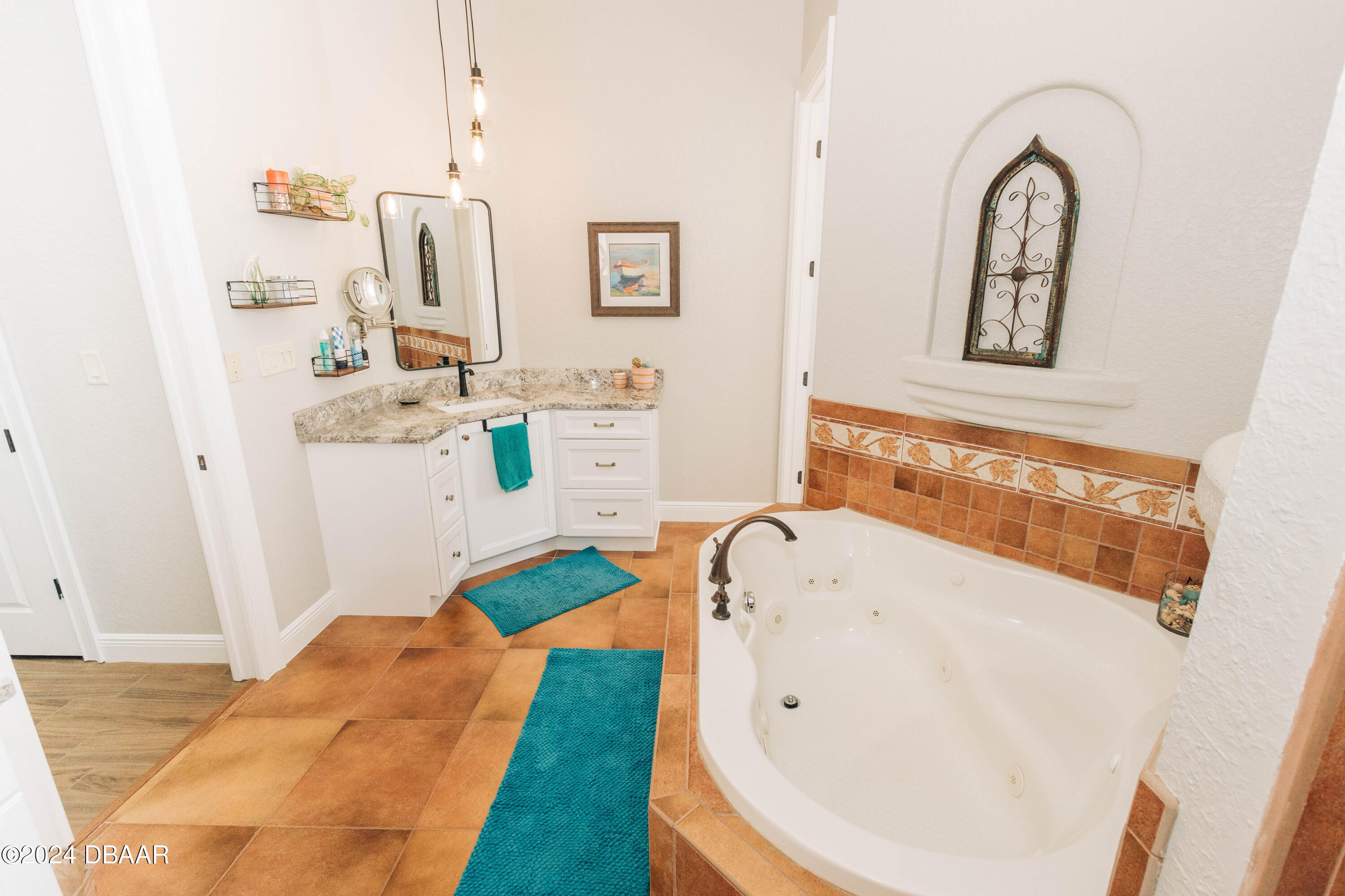 175 Whitcomb Drive Geneva, FL 32732 - Photo 12 of 91 a bathroom with a sink and mirror with bathtub