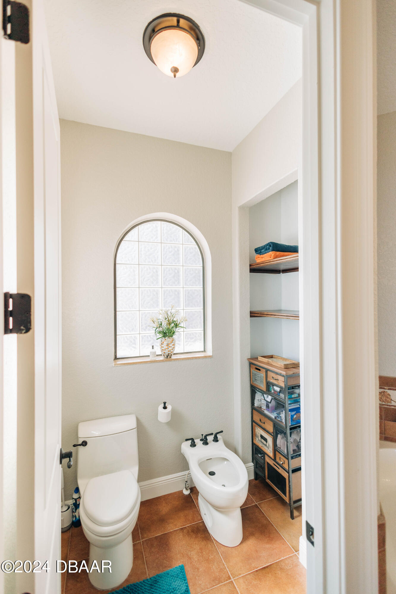 175 Whitcomb Drive Geneva, FL 32732 - Photo 15 of 91 a bathroom with a toilet sink a mirror and vanity