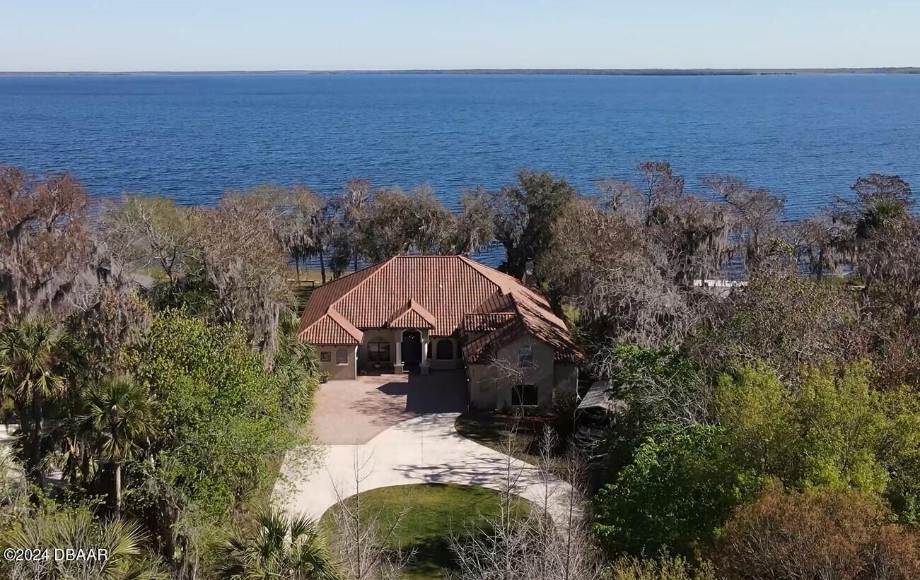 175 Whitcomb Drive Geneva, FL 32732 - Photo 2 of 91 a view of a house with a yard and lake view