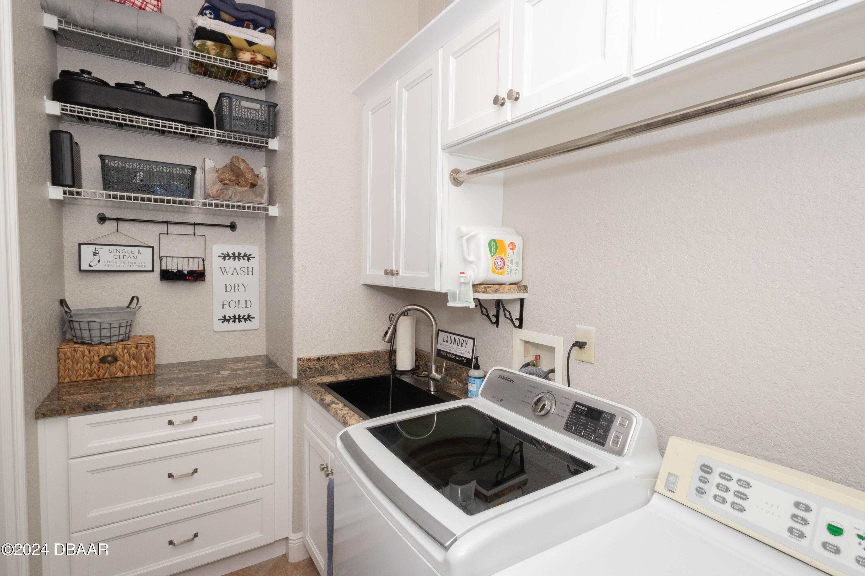 175 Whitcomb Drive Geneva, FL 32732 - Photo 27 of 91 a kitchen with stainless steel appliances granite countertop a sink and a stove