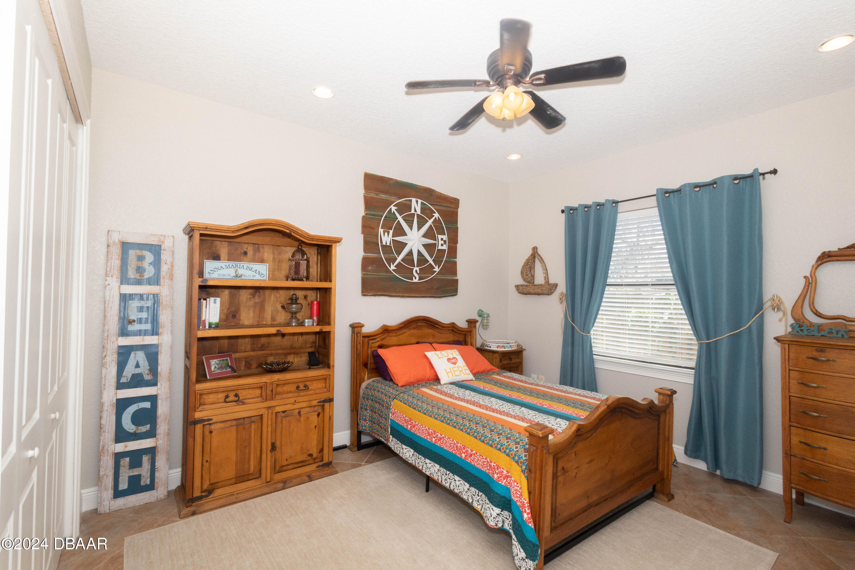 175 Whitcomb Drive Geneva, FL 32732 - Photo 43 of 91 a bedroom with a bed and a chandelier