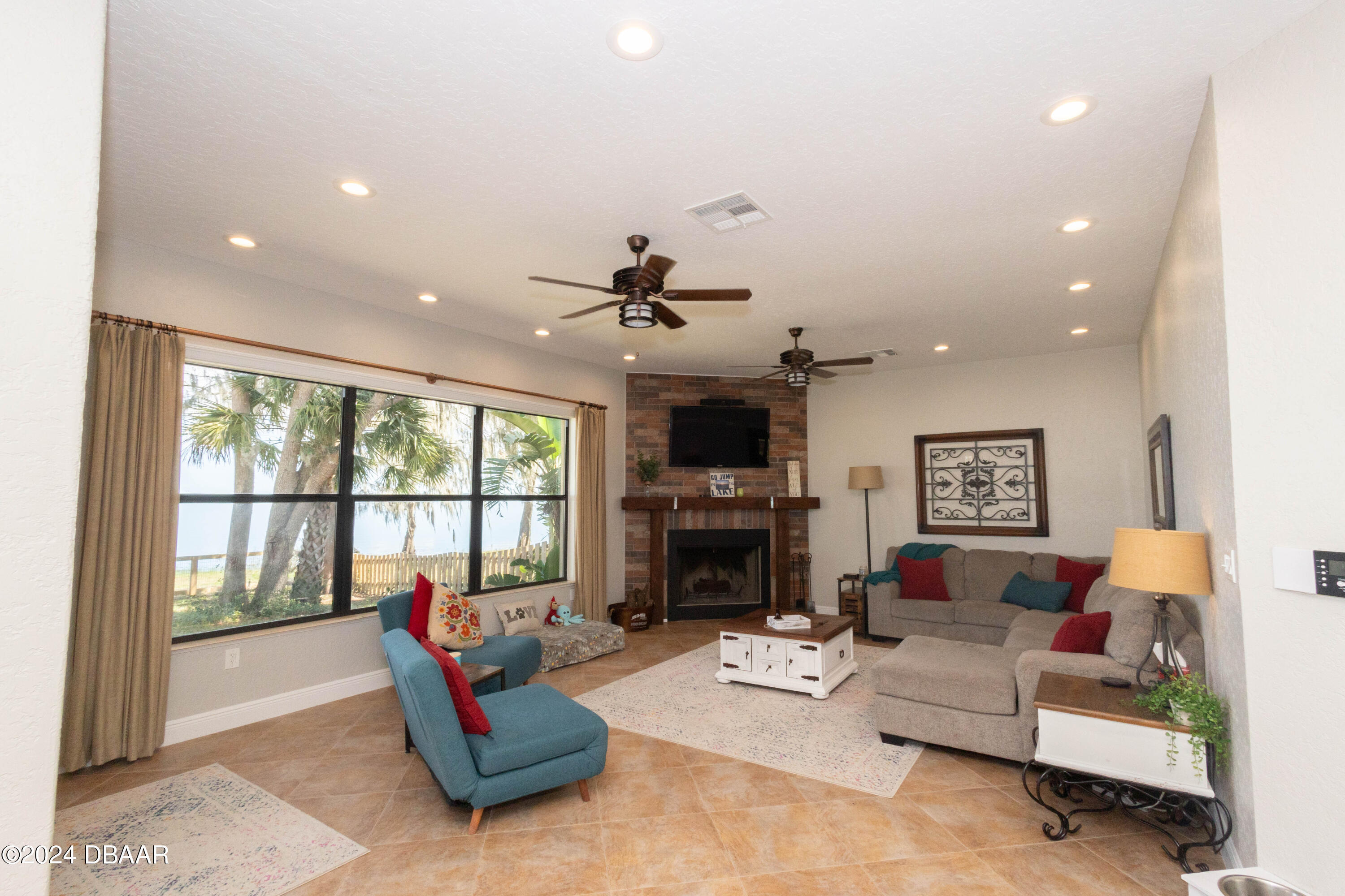175 Whitcomb Drive Geneva, FL 32732 - Photo 46 of 91 a living room with furniture fireplace and a large window
