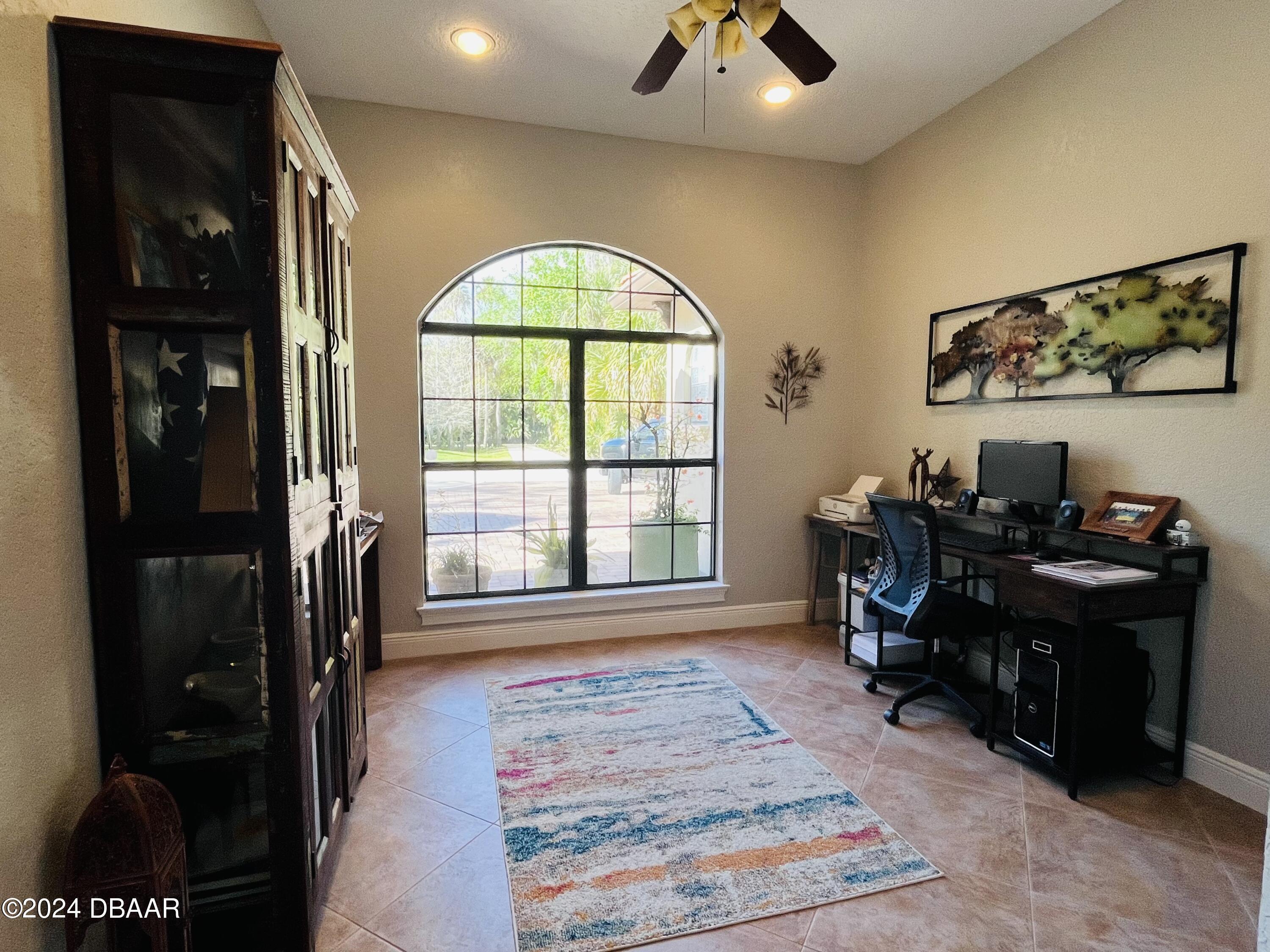 175 Whitcomb Drive Geneva, FL 32732 - Photo 58 of 91 a view of a workspace with furniture and a window