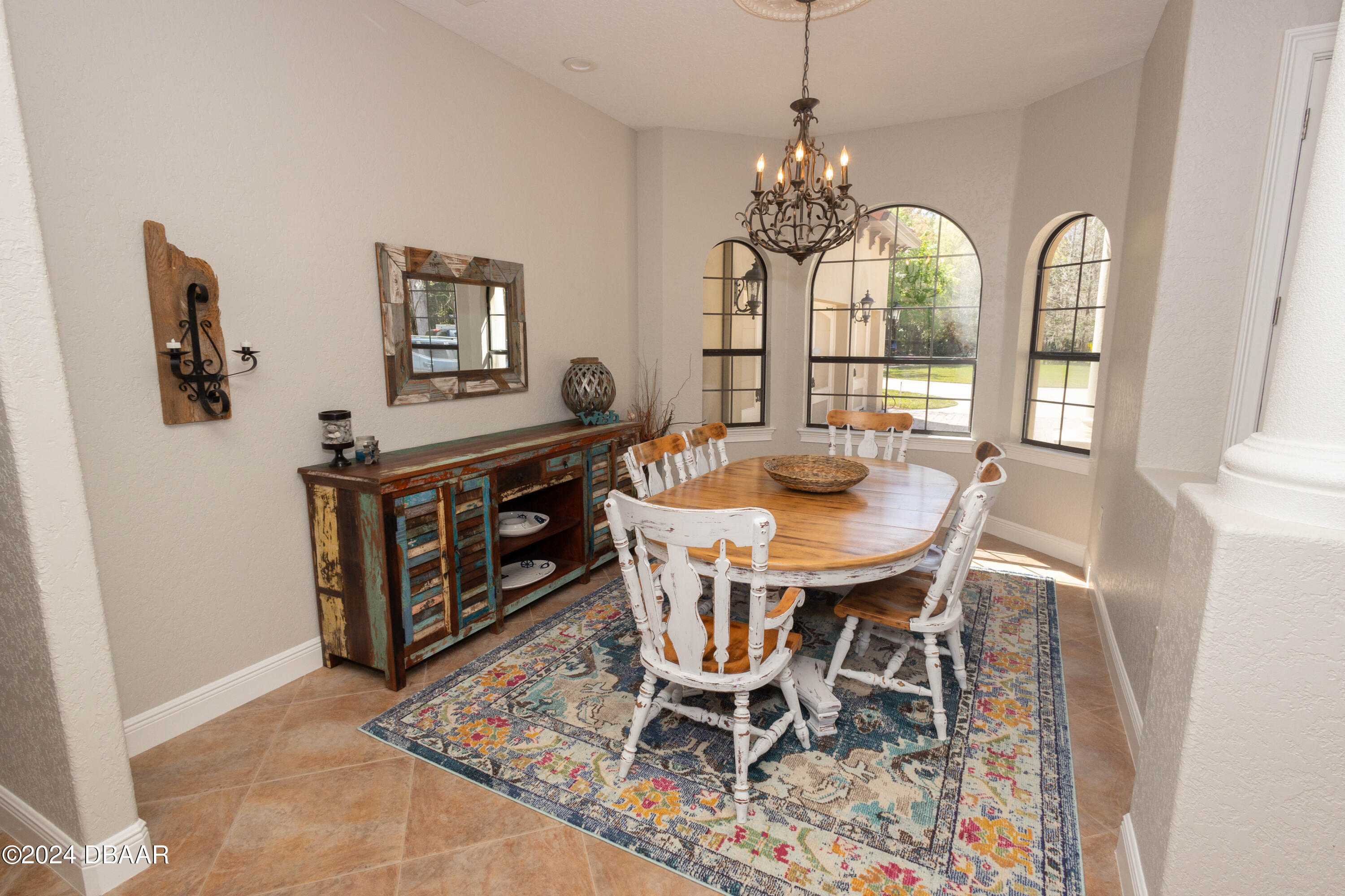 175 Whitcomb Drive Geneva, FL 32732 - Photo 6 of 91 a view of a dining room with furniture a chandelier and wooden floor