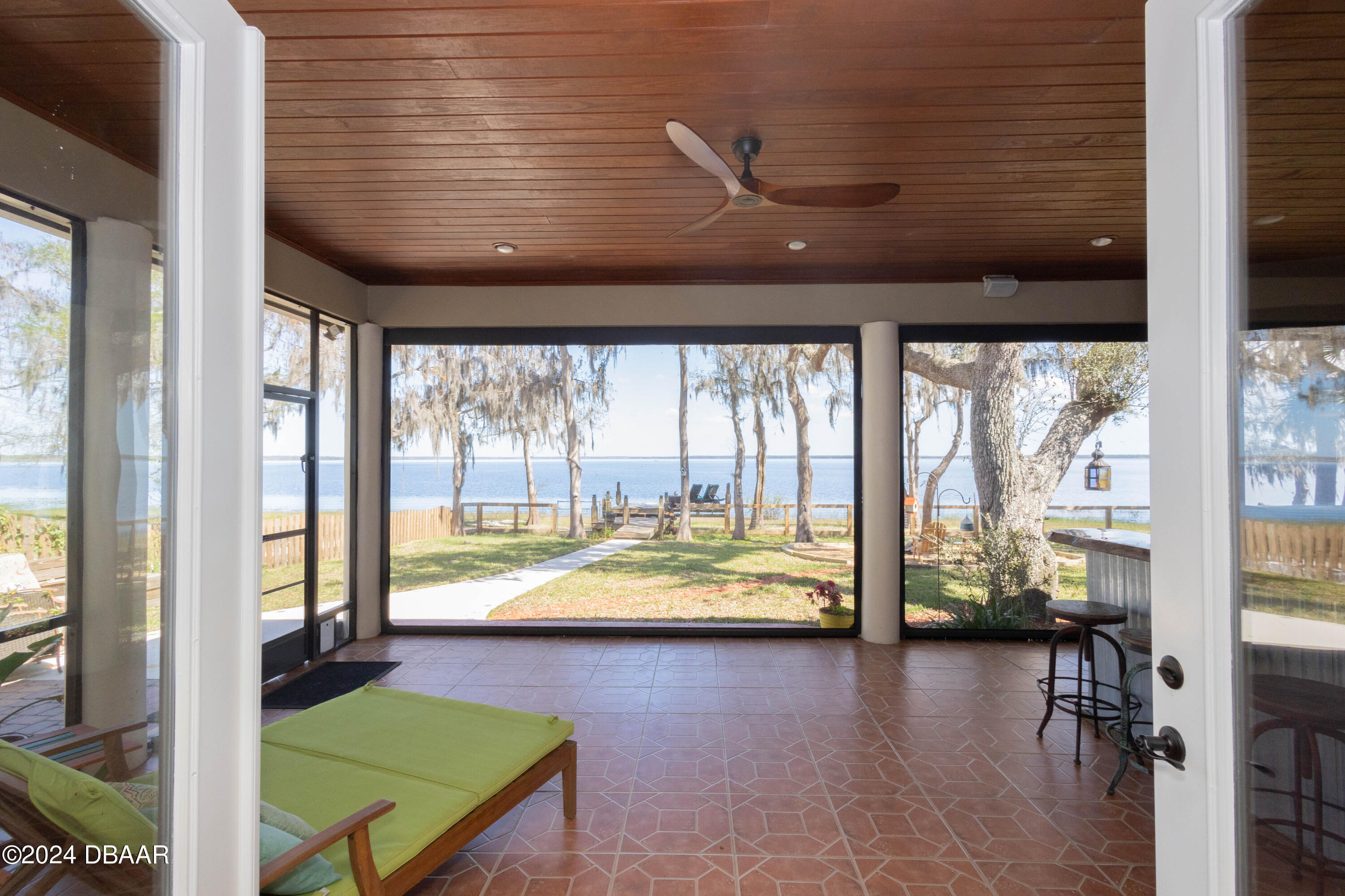 175 Whitcomb Drive Geneva, FL 32732 - Photo 62 of 91 a view of a livingroom with furniture and floor to ceiling window