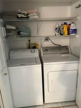 a utility room with dryer and washer