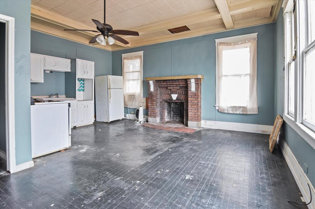 738 1st Street Southwest Paris, TX 75460 - Photo 14 of 25 a view of empty room with a fireplace and window