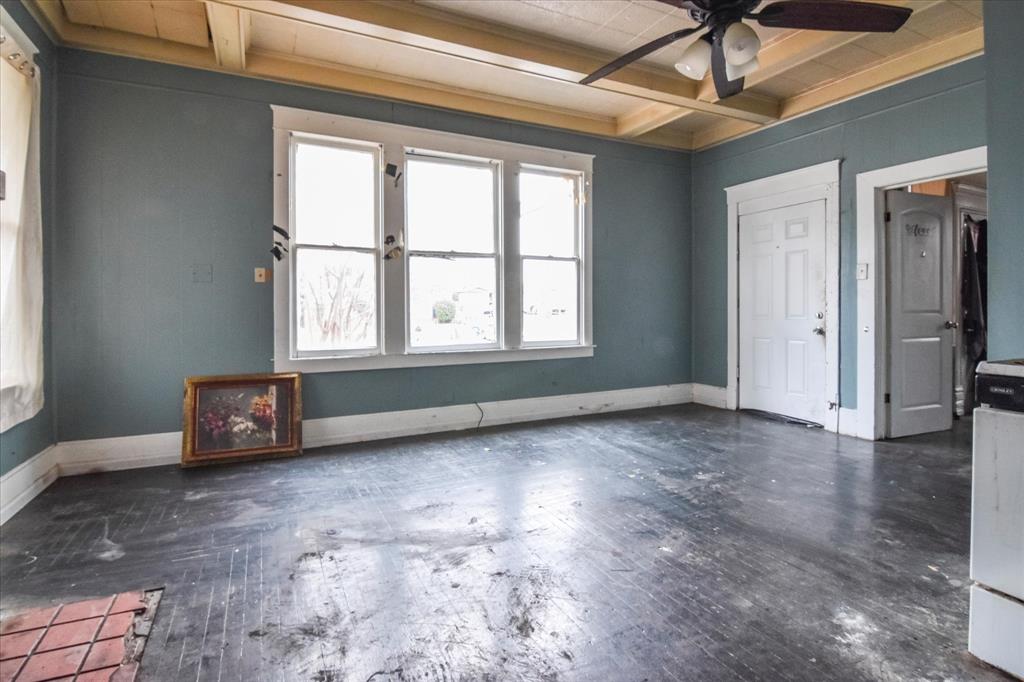 738 1st Street Southwest Paris, TX 75460 - Photo 16 of 25 an empty room with windows and ceiling fan