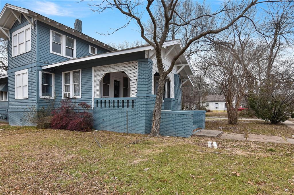 738 1st Street Southwest Paris, TX 75460 - Photo 20 of 25 a front view of a house with a yard