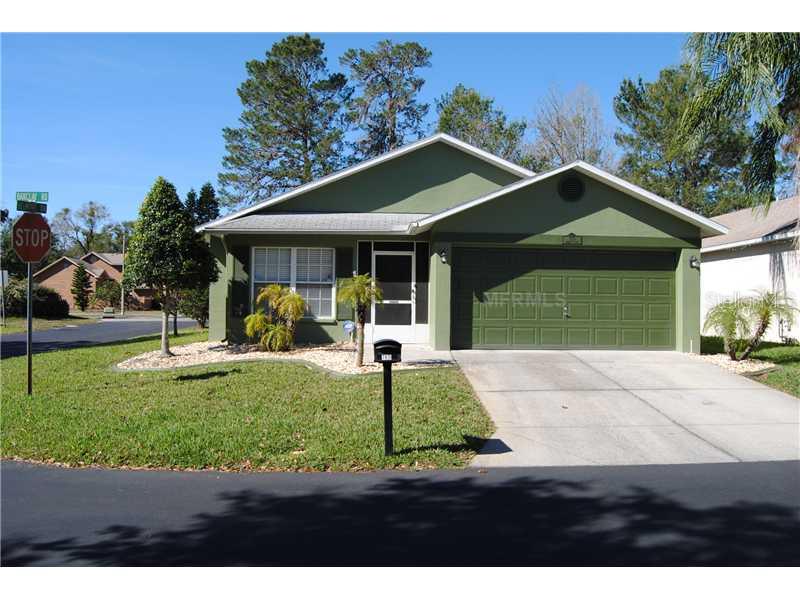 7831 Barclay Road New Port Richey, FL 34654 - Photo 1 of 1 a front view of a house with garden