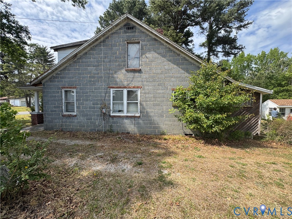 303 Purdy Road Emporia, VA 23847 - Photo 7 of 18 a front view of a house with a yard