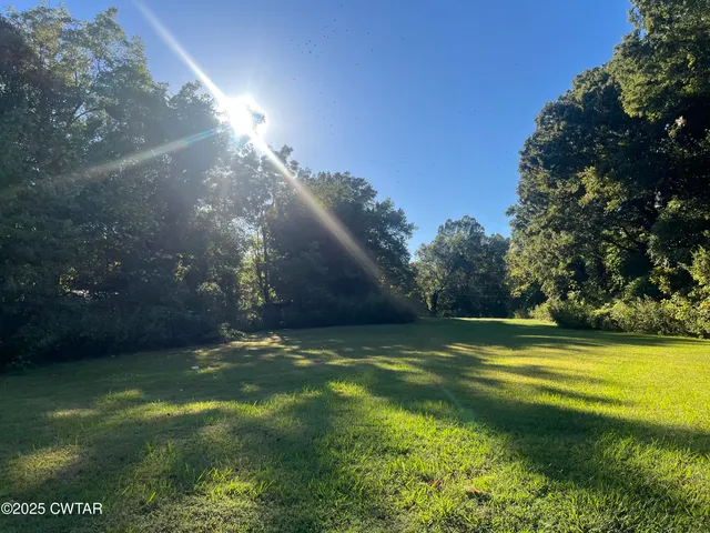 a view of a golf course with a lake