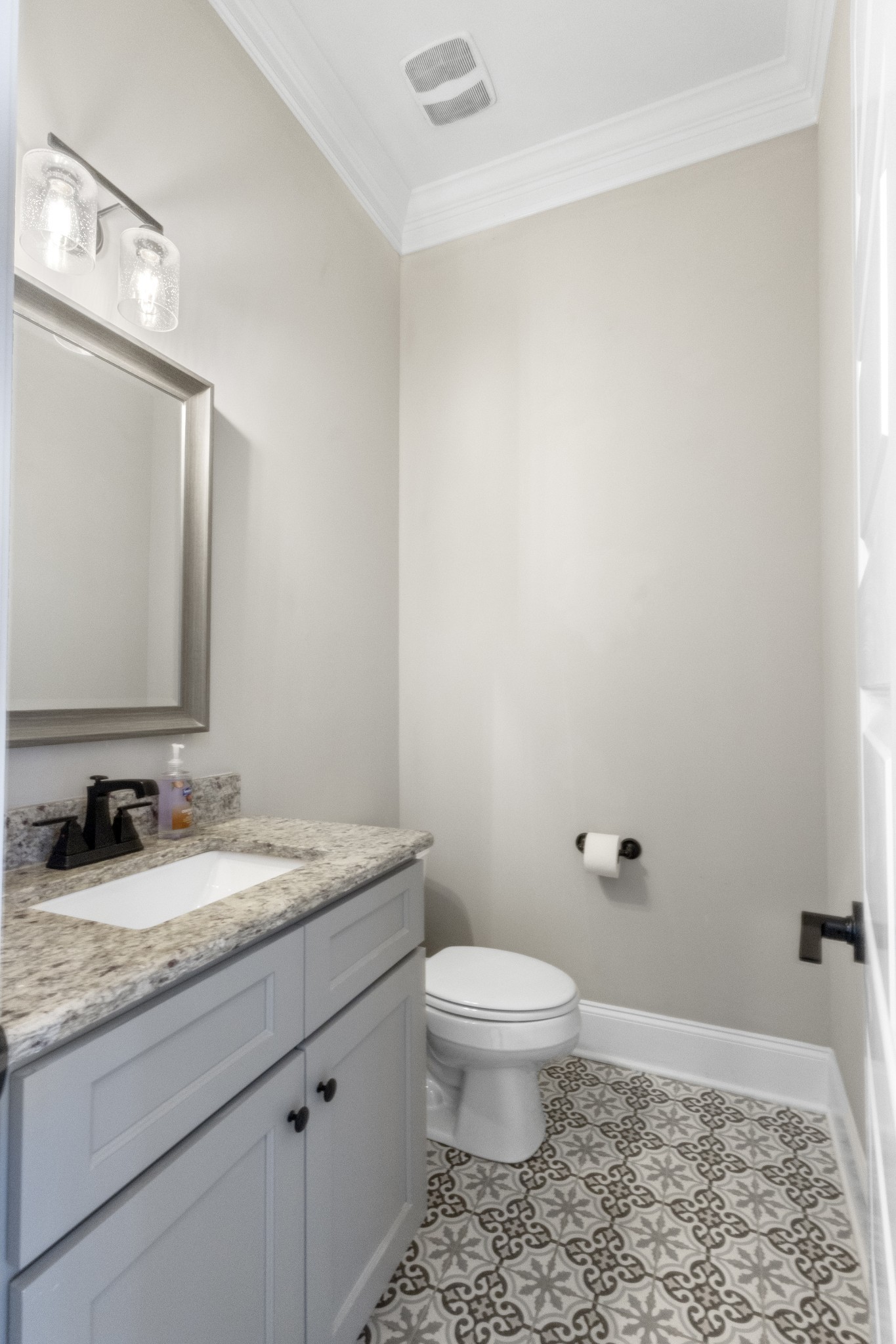 9017 Safehaven Place Spring Hill, TN 37174 - Photo 11 of 50 a bathroom with a granite countertop sink a toilet and a mirror