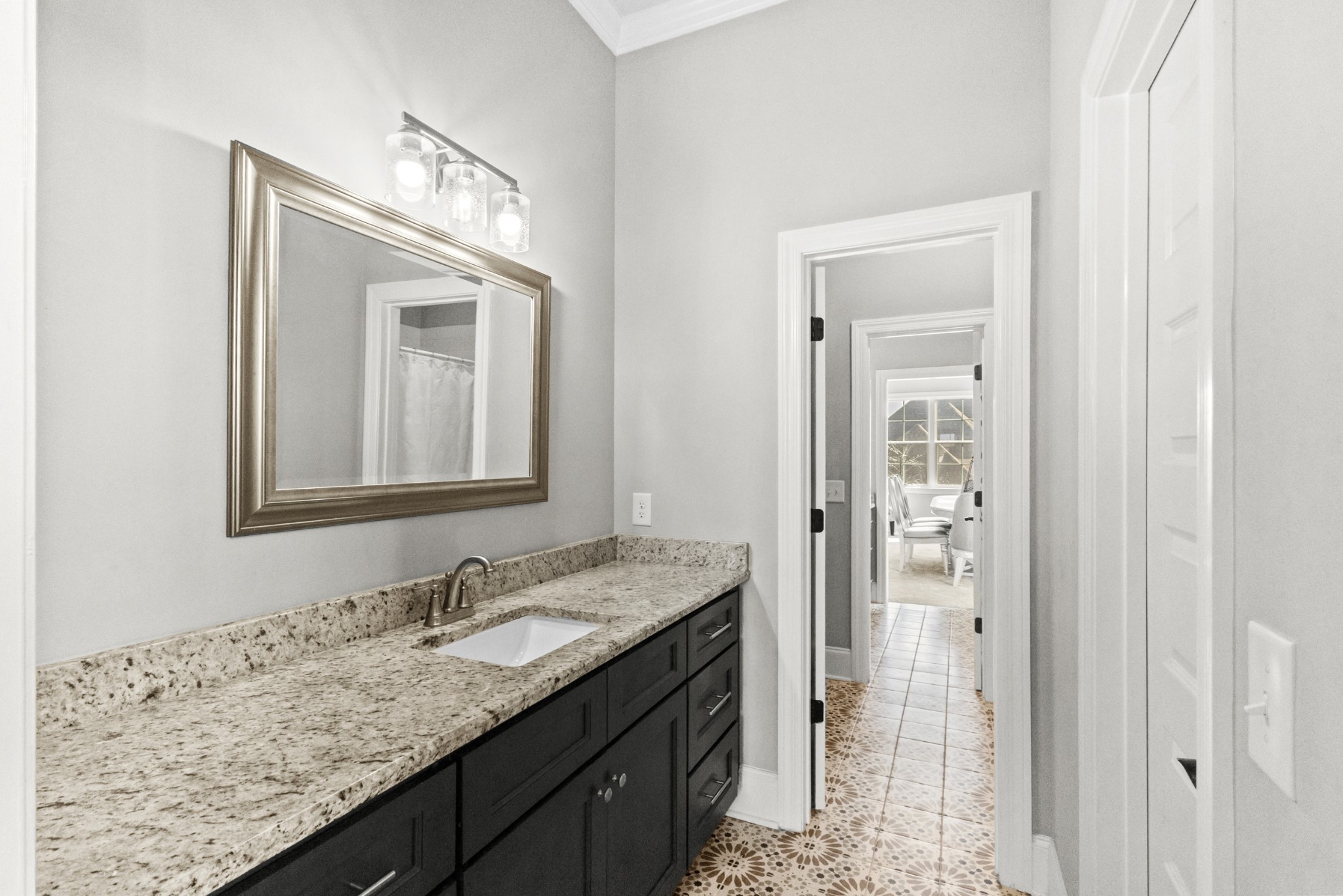 9017 Safehaven Place Spring Hill, TN 37174 - Photo 34 of 50 a bathroom with a granite countertop sink and a mirror
