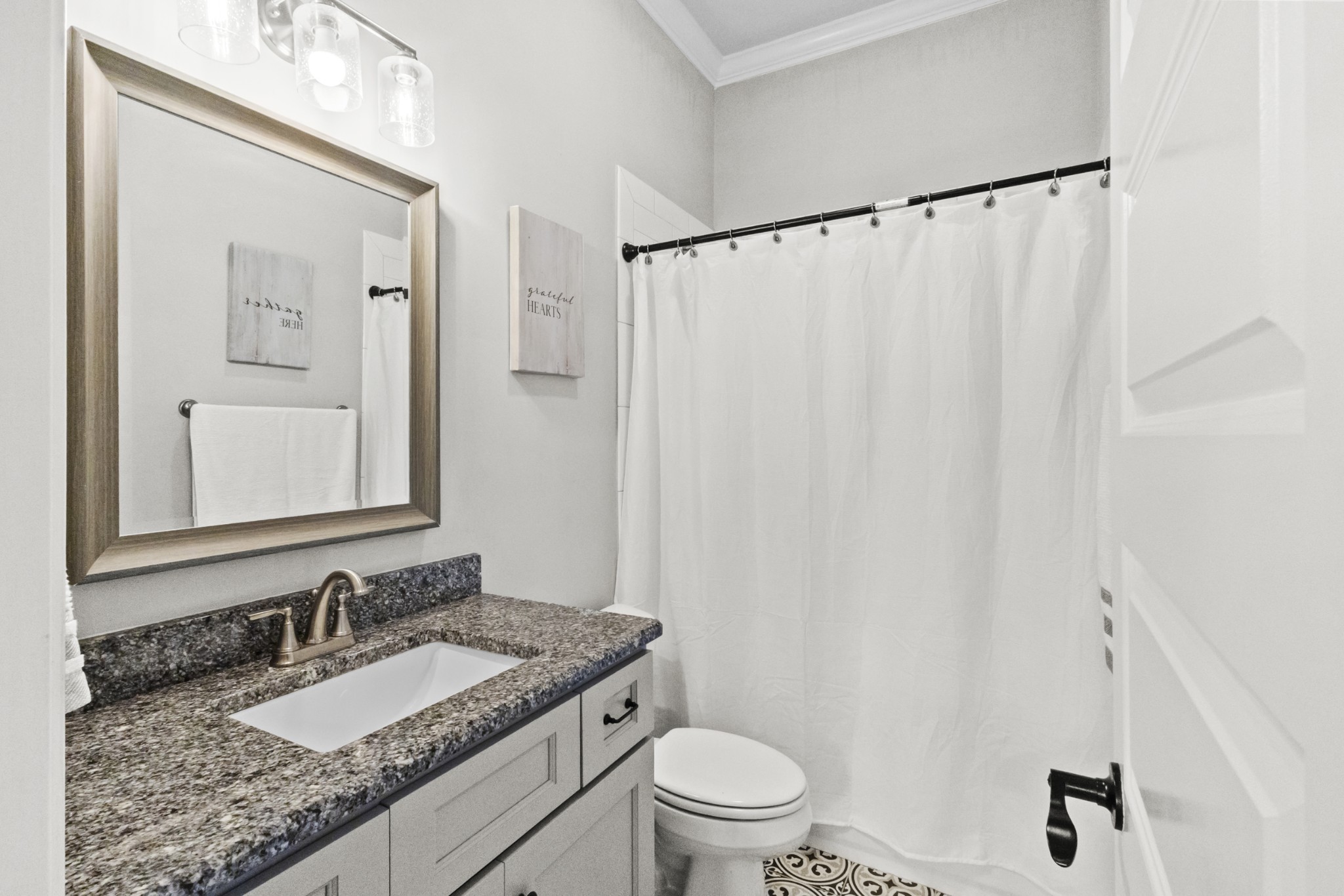 9017 Safehaven Place Spring Hill, TN 37174 - Photo 40 of 50 a bathroom with a granite countertop sink and a mirror