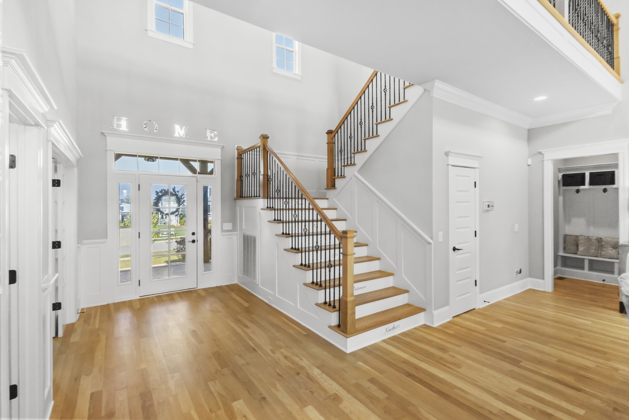 9017 Safehaven Place Spring Hill, TN 37174 - Photo 4 of 50 a view of entryway with wooden floor and stairs