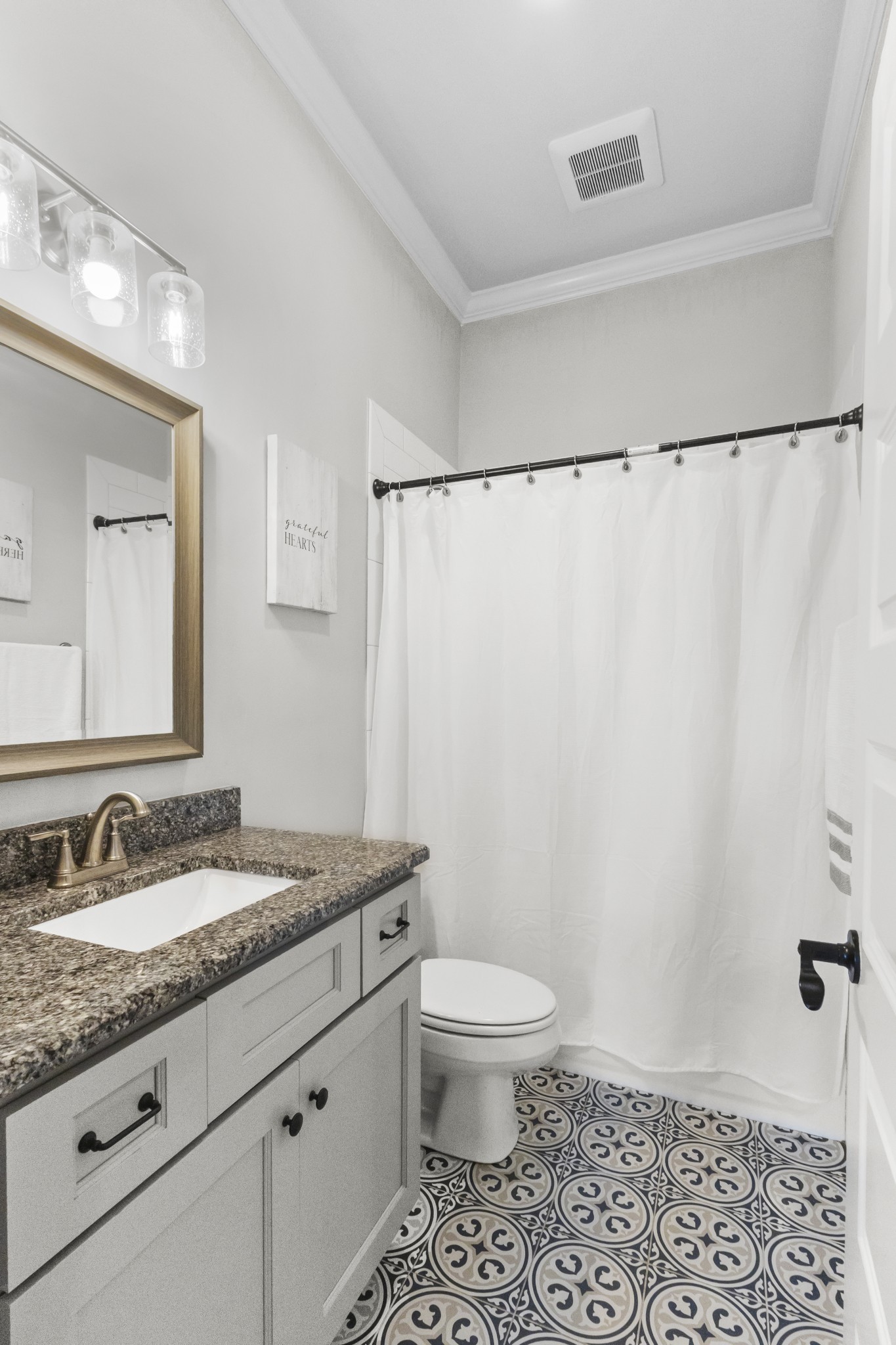 9017 Safehaven Place Spring Hill, TN 37174 - Photo 41 of 50 a bathroom with a granite countertop sink toilet and shower