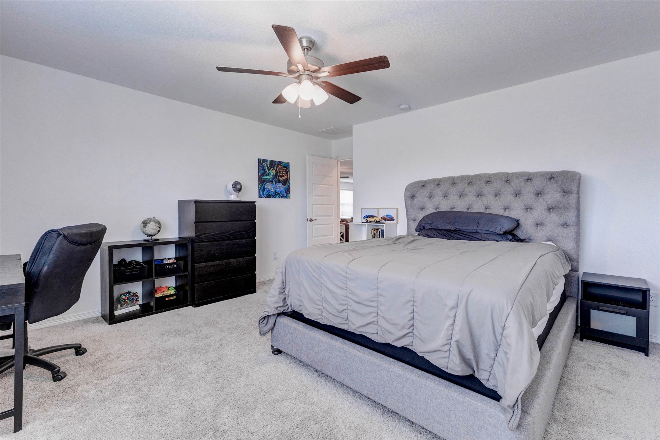 32418 Fly Fish Way Fulshear, TX 77441 - Photo 32 of 40 There is ample space to comfortably fit a queen or king size bed alongside additional furniture, making it a welcoming retreat for family or guests.