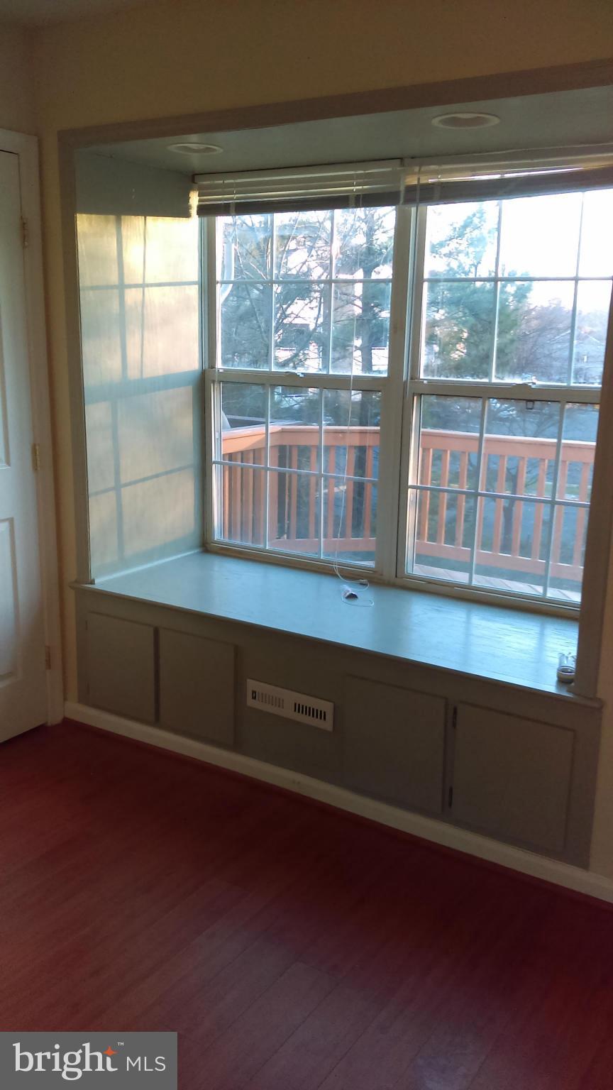 11117 Light Guard Loop Manassas, VA 20109 - Photo 22 of 25 a room with wooden floor and a window